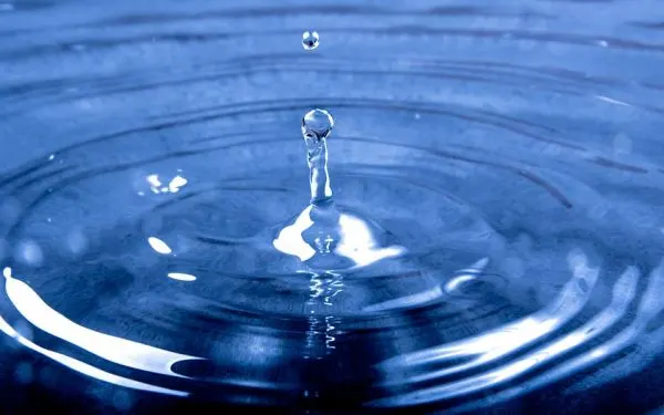 Close-up of a water drop creating ripples